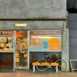 a bike parked outside of a store front