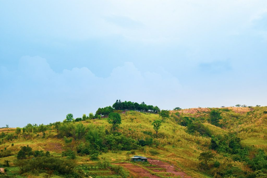 a hill with a house on top of it