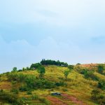 a hill with a house on top of it